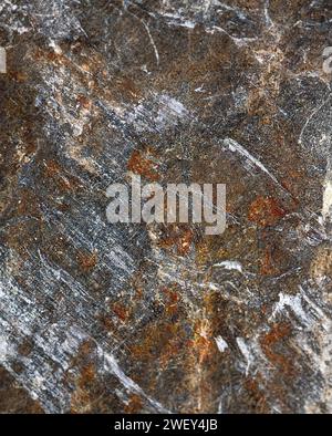 Natural rock design with white lines on and textured rustic surface. Background. Stock Photo