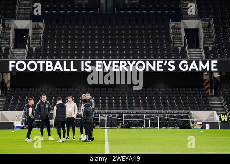 Fulham players inspect the pitch ahead of during the Emirates FA Cup fourth round match at Craven Cottage, London. Picture date: Saturday January 27, 2024. Stock Photo