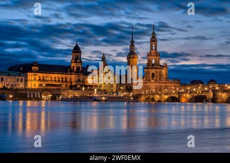 The Sekundogenitur, tower Hausmannsturm and Cathedral of the Holy Trinity in the old part of town, seen over the river Elbe at high water level illumi Stock Photo