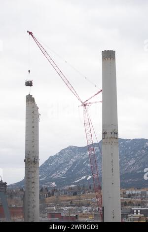 A crane takes down one of two smokestacks on the former coal burning power plant for Colorado Springs Utilities. Stock Photo