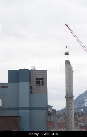 A crane takes down one of two smokestacks on the former coal burning power plant for Colorado Springs Utilities. Stock Photo