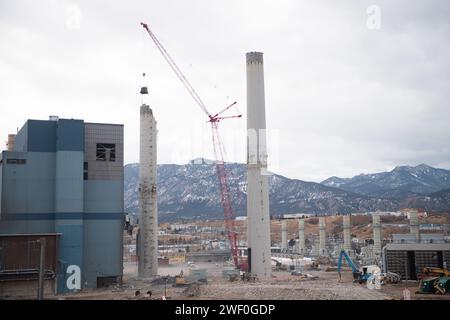 A crane takes down one of two smokestacks on the former coal burning power plant for Colorado Springs Utilities. Stock Photo