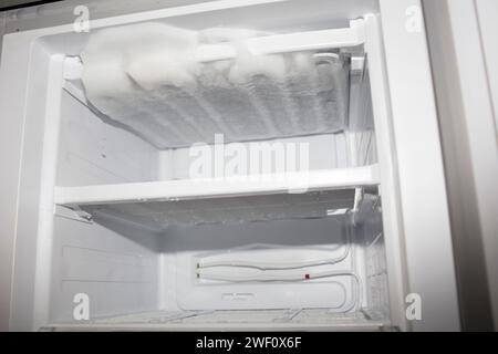 defrost refrigerator. melting ice in fridge Stock Photo