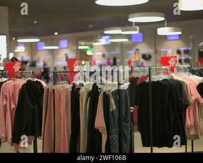 Brussels, Belgium. 26nd Jan, 2024. Fashionable clothes. Winter fashion in Europe. Discounts. Interior of a large shopping mall in Brussels near Roger Stock Photo