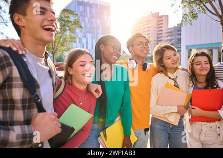 Happy young multiracial university students posing together taking a photo Stock Photo