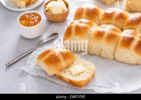 Hot cross buns served with butter and orange marmalade, recipe for Easter brunch or breakfast Stock Photo