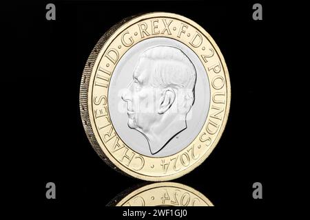 2024 £2 coin featuring the first portrait of King Charles III and was designed by Martin Jennings. Stock Photo