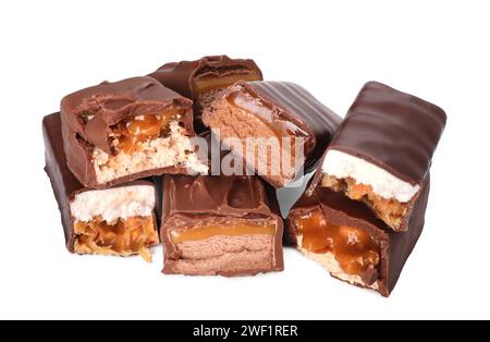 Pieces of tasty chocolate bars with nougat and nuts on white background Stock Photo