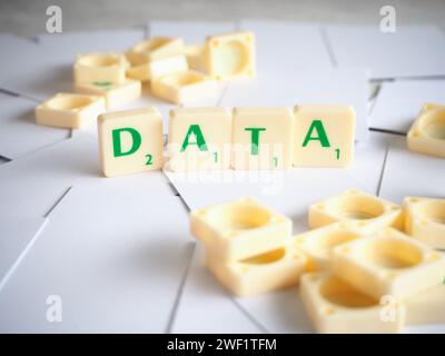 Scrabble letters spelling words DATA. DATA is facts and statistics collected together for reference or analysis Stock Photo