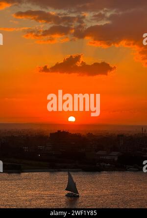 Cairo, Egypt. 27th Jan, 2024. A boat sails on the Nile River at sunset in Cairo, Egypt, on Jan. 27, 2024. Credit: Wang Dongzhen/Xinhua/Alamy Live News Stock Photo