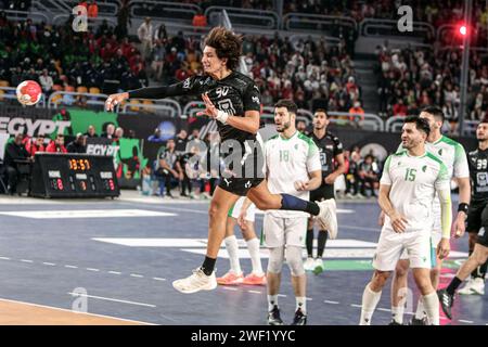 Cairo, Egypt. 27th Jan, 2024. Ali Mohamed (top) of Egypt shoots during the final between Egypt and Algeria at the 2024 African Men's Handball Championship in Cairo, Egypt, Jan. 27, 2024. Credit: Ahmed Gomaa/Xinhua/Alamy Live News Stock Photo