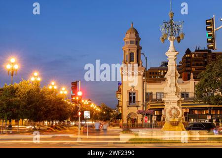 Night time view of historic church towers and downtown skyline of Kansas City, Missouri, USA. Stock Photo
