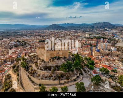 Aerial view of Petrer, medieval town and hilltop castle with restored tower and battlements near Elda Spain, Stock Photo
