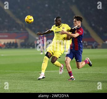 Barcelona, Spain. 27th Jan, 2024. HECTOR FORT of FC Barcelona, right, and ERIC BAILLY of Villarreal CF battle for the ball during the La Liga EA Sports between FC Barcelona and Villarreal CF at Estadi Olimpic Lluis Company in Barcelona. (Credit Image: © Xavi Urgeles/ZUMA Press Wire) EDITORIAL USAGE ONLY! Not for Commercial USAGE! Credit: ZUMA Press, Inc./Alamy Live News Stock Photo