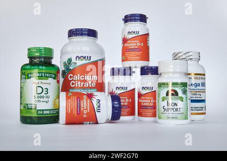 Set of Healthy Food Supplements, many jars of vitamins and minerals from site iHerb online store. Gray background. Biologically active additive, Healt Stock Photo