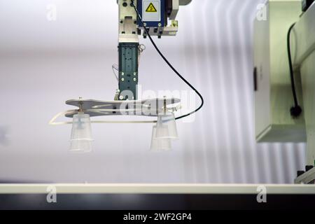 The process of manufacturing plastic products in automated production Stock Photo