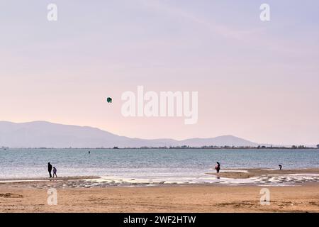 Many people go to Trabucador beach, in the Ebro delta, Catalonia, to walk and enjoy shallow waters, beautiful sunsets, birds and good food. Land of ri Stock Photo