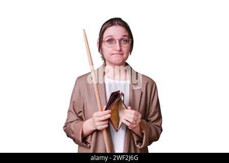 Sad woman teacher holding empty wallet with no money on studio blue ...