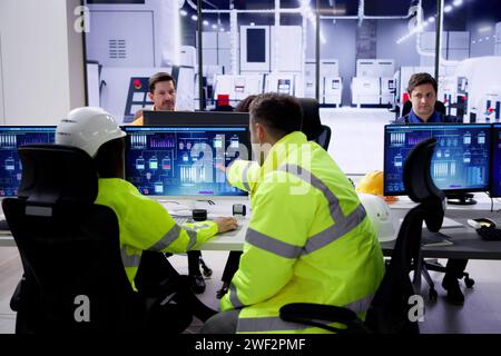 Engineer Operators Using Scada System At Industrial Plant Stock Photo