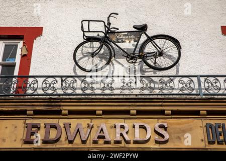 UK, Wales, Gwynedd, Conwy (Conway), town centre, High Street, Edwards butchers shop delivery bike sign Stock Photo