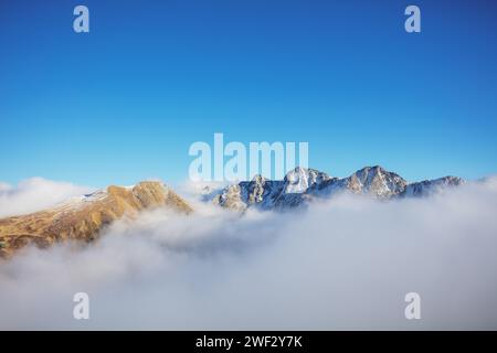 Mountains minimalist landscape. Peaks of the mountains above the clouds. Pyrenees, Andorra, Europe Stock Photo