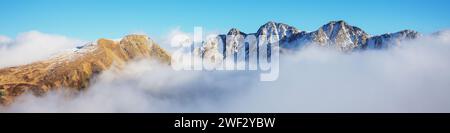 Mountains minimalist landscape. Peaks of the mountains above the clouds. Pyrenees, Andorra, Europe. Horizontal banner Stock Photo