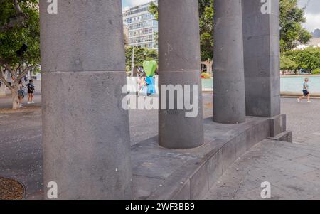 Tourists and visitors at the Santa Elena park in the centre of the Tenerife city of Santa Cruz having their photo in front of the Santa Cruz sculpture. Stock Photo