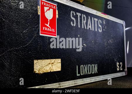 Well travelled flight cases belonging to Dire Strait's frontman Mark Knopfler, being sold for charity at auction along with 120 guitars. Stock Photo