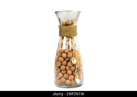 Leca Clay balls in a sleek glass bottle vase isolated on white background Stock Photo