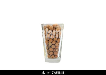 Leca clay balls artfully arranged in a transparent glass vase on white isolated background Stock Photo