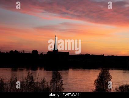 Winter sun setting across the Loire River casting beautiful refections Stock Photo