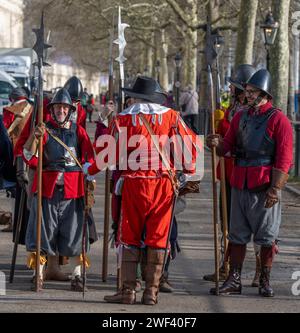 The Mall, London, UK. 28th Jan, 2024. English Civil War reenactors march from St James Palace to Horseguards Parade to hold their annual ceremony and service in memory of the beheaded monarch Charles I. On 30 January 1649 Charles I was beheaded on a scaffold outside the Banqueting House in Whitehall. Credit: Malcolm Park/Alamy Live News Stock Photo