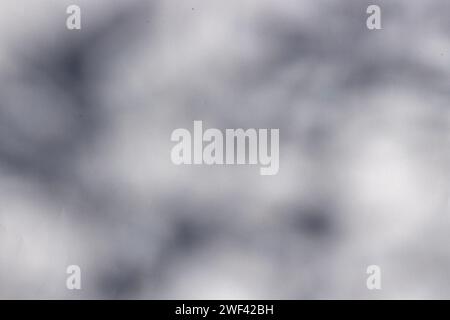 Upward perspective of a dark shadow against a white backdrop. Top perspective of a dark shadow on a white background. Stock Photo
