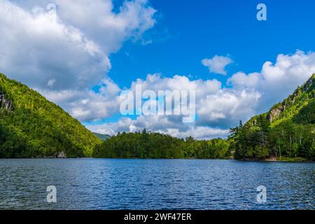 Embarking on an Adirondack adventure, discovering scenic landscapes, and tranquil waterfront serenity on a refreshing hiking expedition Stock Photo