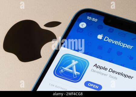 Apple Developer app is seen in the App Store on an iPhone. Stock Photo