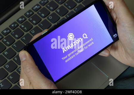 AWS user watches an introduction video of Amazon Q, an AI-powered chatbot for businesses unveiled at the AWS re:Invent conference, on its official web... Stock Photo