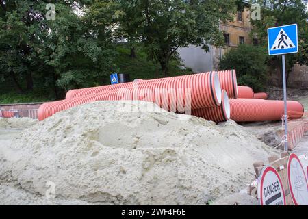 repair the street in the city a lot of sand with sewage pipes Stock Photo