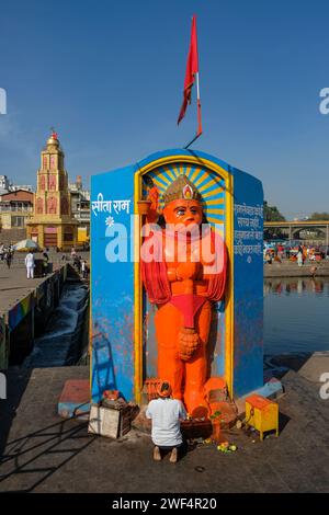 Nashik, India - January 25, 2024: A man praying at the Ganga Ghat in Nashik, India. Stock Photo