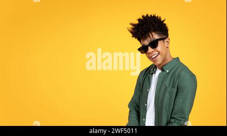 Stylish young african american guy wearing sunglasses Stock Photo