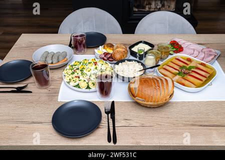 Traditional dishes from Poland for Easter breakfast, lying on the table in the dining room. Stock Photo
