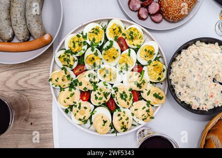 Traditional dishes from Poland for Easter breakfast, visible eggs with mayonnaise and stuffing. Stock Photo