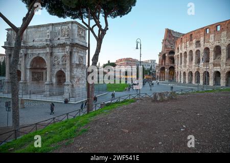Rome, Italy - March 17 2018: Arch of Constantine and the Coliseum at twilight. Stock Photo