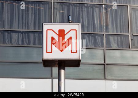 Lille, France - June 22 2020: Sign of the Lille Metro (French: Métro de Lille Métropole) outside the entrance of a subway station. The network is a dr Stock Photo