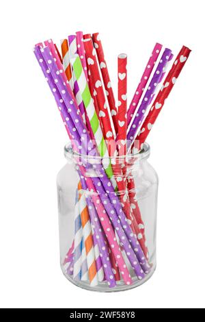 Colorful paper straws in a glass isolated on white background Stock Photo