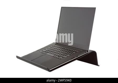 Laptop or ultrabook on a portable stand isolated on white background Stock Photo