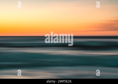 Creative abstract background. Sea and sky at sunset, motion blur, copy space Stock Photo