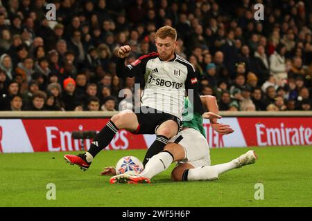 London, UK. 28th Jan, 2024. Harrison Reed of Fulham is tackled during the FA Cup 4th Round match between Fulham and Newcastle United at Craven Cottage, London, England on 27 January 2024. Photo by Ken Sparks. Editorial use only, license required for commercial use. No use in betting, games or a single club/league/player publications. Credit: UK Sports Pics Ltd/Alamy Live News Stock Photo