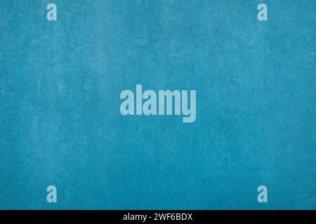 Empty plastered blue cement painted plain rough surface clean wall backdrop background Stock Photo
