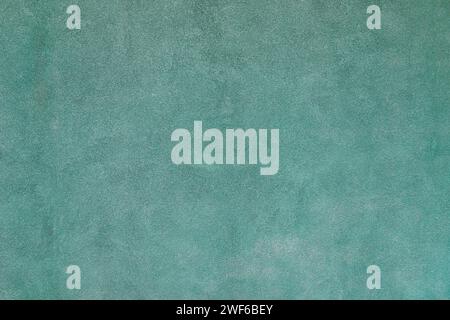 Empty plastered green cement painted plain rough surface clean wall backdrop background Stock Photo