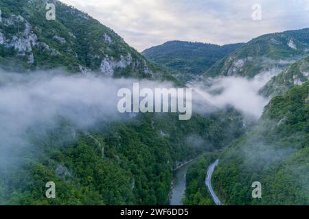 Aerial view of green Tara river canyon, nature landscape with some clouds from summit in Durmitor national park near Zabljak Stock Photo